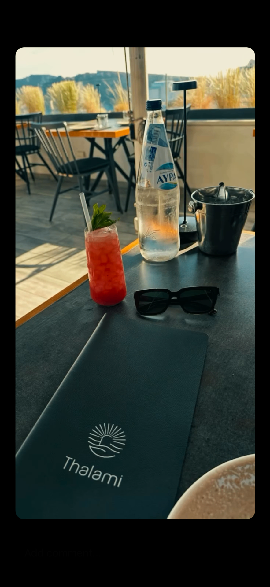 Sunset dinner on a Santorini restaurant terrace